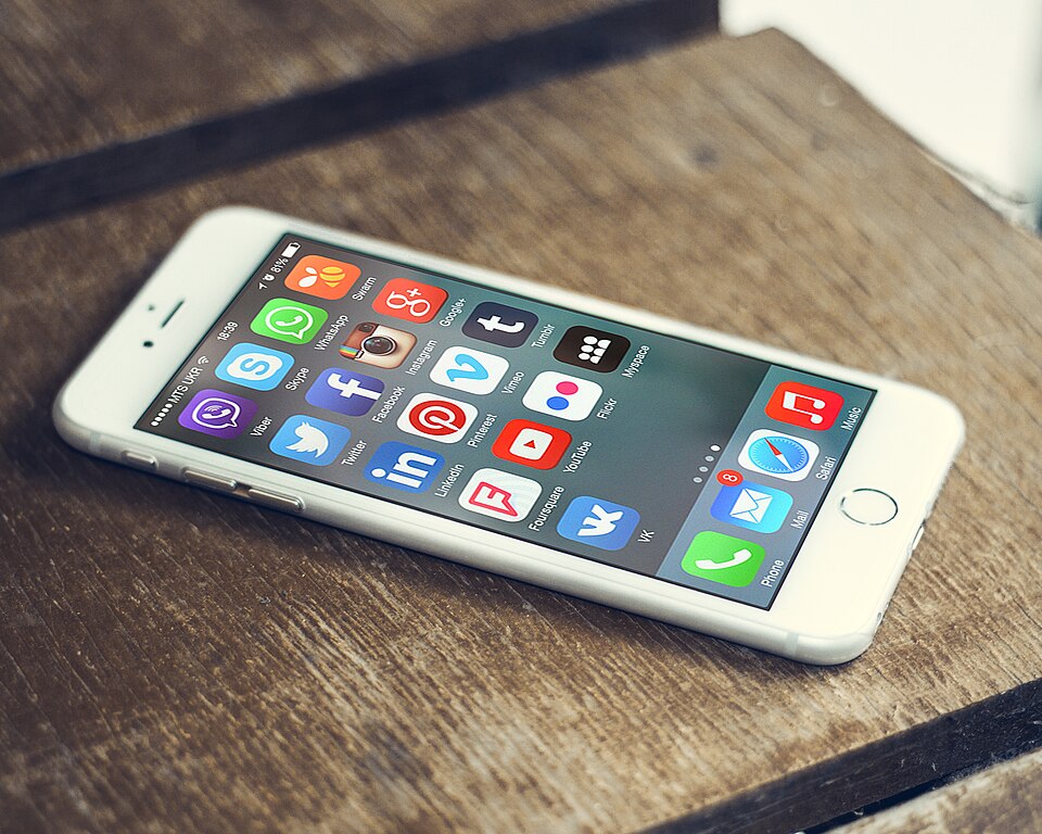 Social media app icons on a smartphone screen